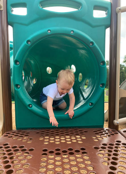 istock Toddler Boy on Playground Slide 1339114671