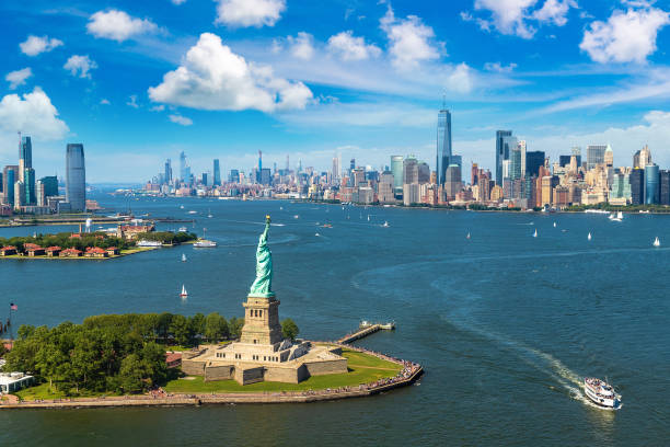 Statue of Liberty n New York Panoramic aerial view Statue of Liberty and Jersey City and Manhattan cityscape in New York City, NY, USA aircraft point of view stock pictures, royalty-free photos & images