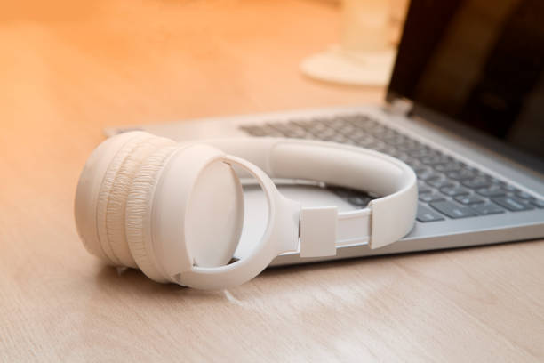 istock Headphones and a laptop on the table 1339120729