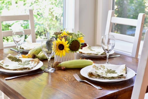 fall autumn thanksgiving table setting for celebratory festive family dinner. - flower arrangement dining room decor dining imagens e fotografias de stock