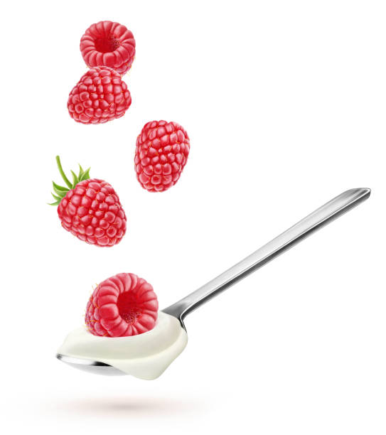 istock Spoon with natural yogurt and falling raspberries isolated on white 1339126596