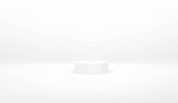 istock White podium. Pedestal. Scene. Vector illustration. Abstract futuristic background. White cylinder on a white surface with a white background 1339134356