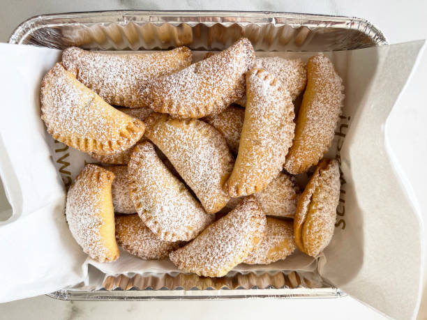 sweet empanadas in box stock photo