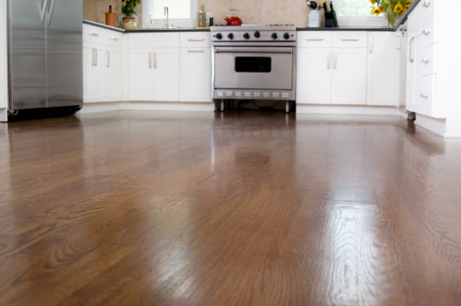 Hardwood floors in a custom kitchen.  Focus on floor.
