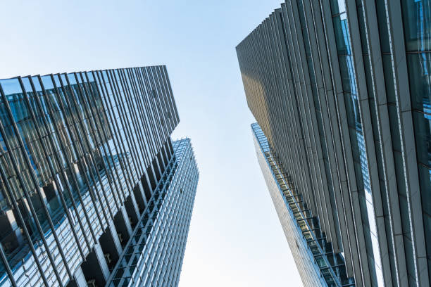 istock Low angle view between two glass curtain wall buildings 1339142036