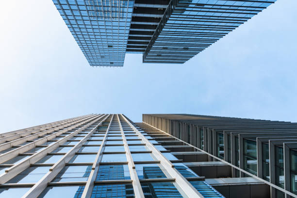 istock Low angle view between two glass curtain wall buildings 1339142037