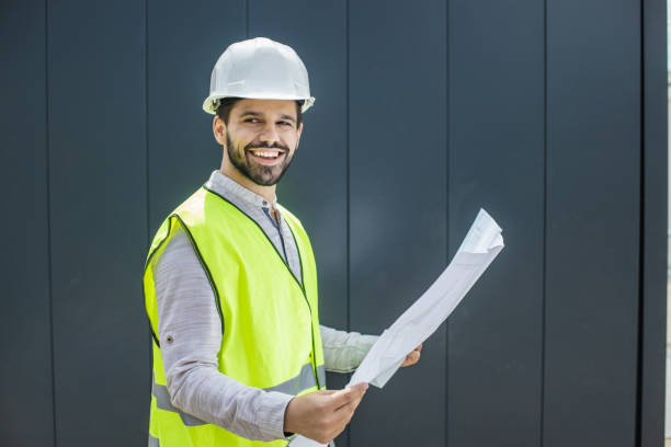 istock Portrait of a young civil engineer holding technical drawing 1339142672