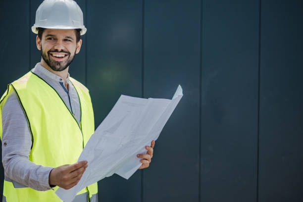 istock Portrait of a young civil engineer holding technical drawing 1339142933