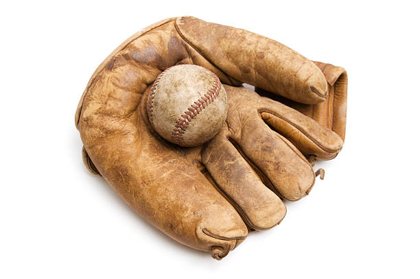 Vintage Baseball and Glove A vintage baseball and baseball glove isolated on white. old baseball stock pictures, royalty-free photos & images