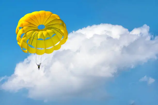 Photo of Paragliding using a parachute.