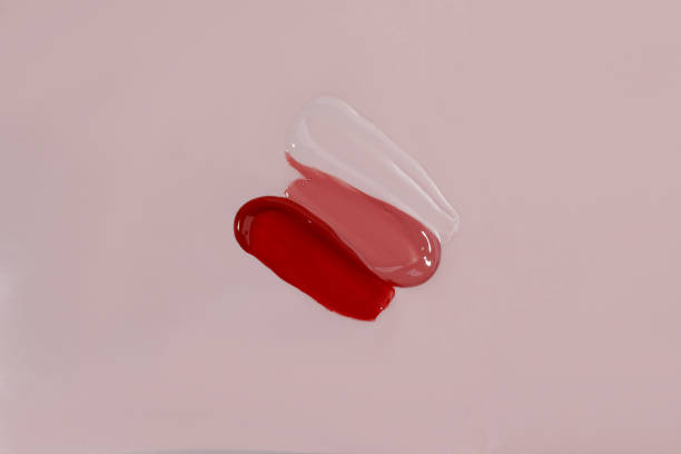 istock Three shiny lip gloss swatches on pink background. 1339152857