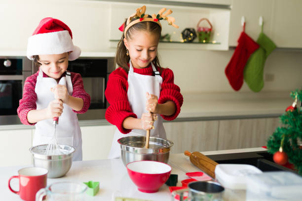 istock Caucasian children making cookie dough 1339154938