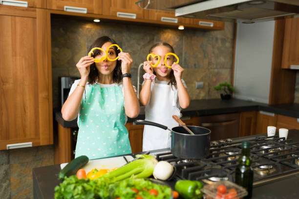 istock Mother and daughter enjoying cooking 1339155775