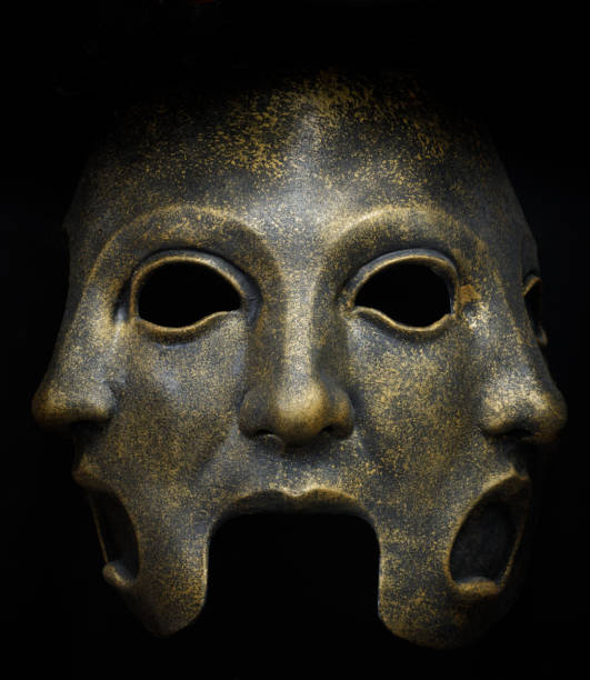 Three Faces Latex Mask Isolated Against Black Background.