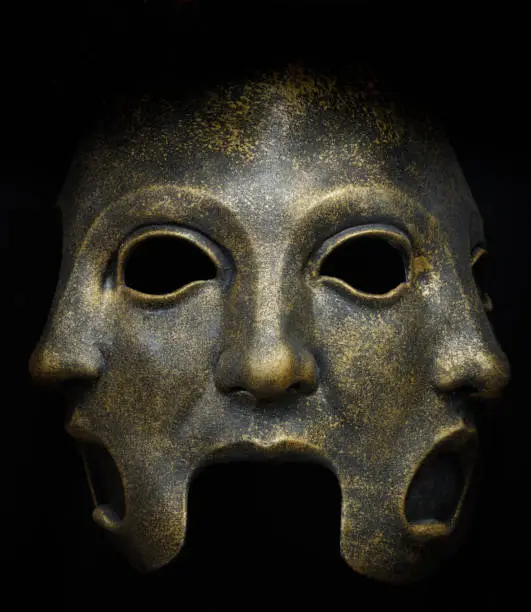 Three Faces Latex Mask Isolated Against Black Background.