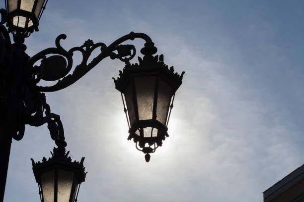istock classic old street lamp backlit silhouette during daytime 1339158763