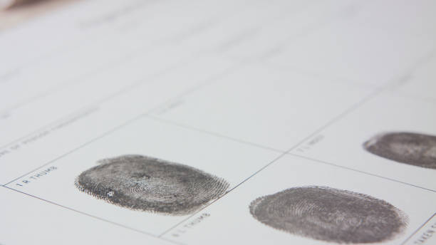 istock filling form macro fingerprint registration finger print form paperwork 1339160178