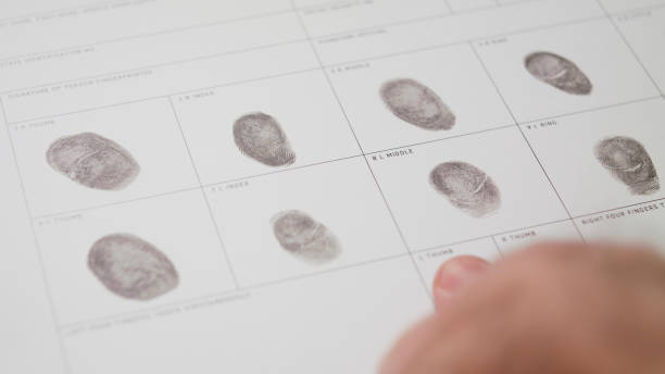 istock filling form macro fingerprint registration finger print form paperwork 1339160186