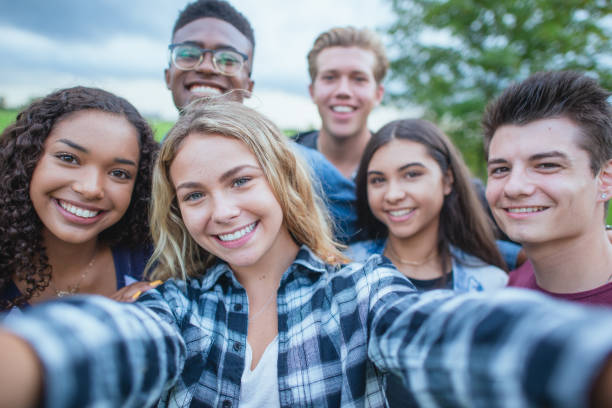 istock Diverse group of teenagers taking a group selfie 1339161063