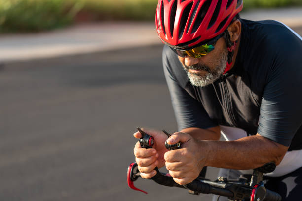 istock Senior cyclist training with time trial bike 1339163257