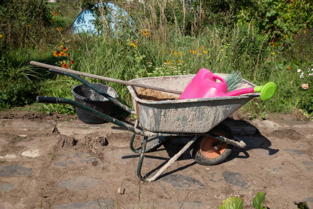 istock A garden wheelbarrow filled with sand and dry cement mixture stands on the path 1339167166