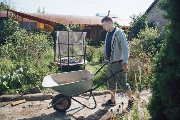 istock A man carries a garden wheelbarrow for loading sand to fill the paths 1339167182