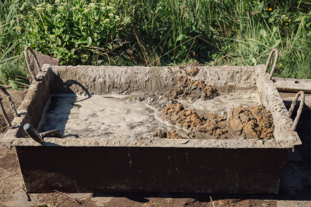 istock Kneading cement for pouring garden path, garden construction work 1339167244