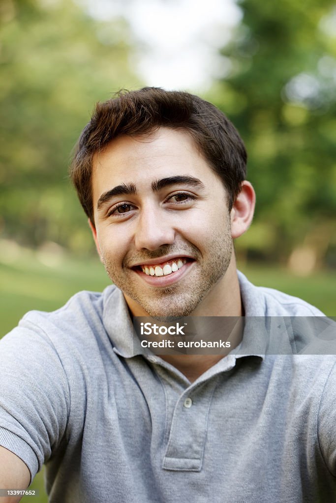 Young Man Portrait Portrait of a young man in his early 20s at the park. 20-24 Years Stock Photo