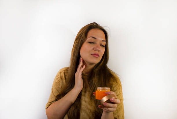 istock young beautiful woman uses face cream 1339188937