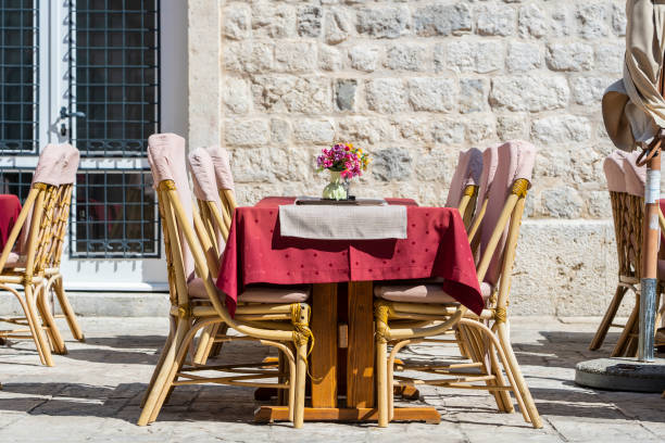 istock Rattan chairs and table in a street restaurant 1339189651