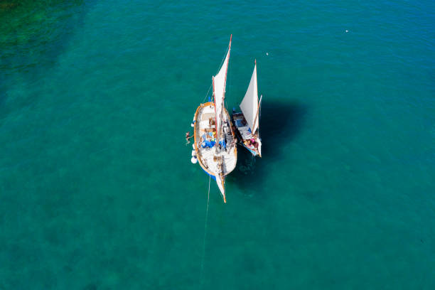 istock Anchored classic sailboats 1339192802