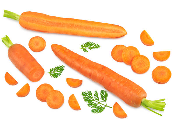 istock sliced carrot with green leaves isolated on white background. clipping path. top view 1339192838