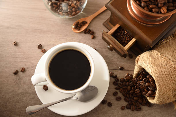 istock Cup coffee sack and grinder on wooden table top view 1339194881