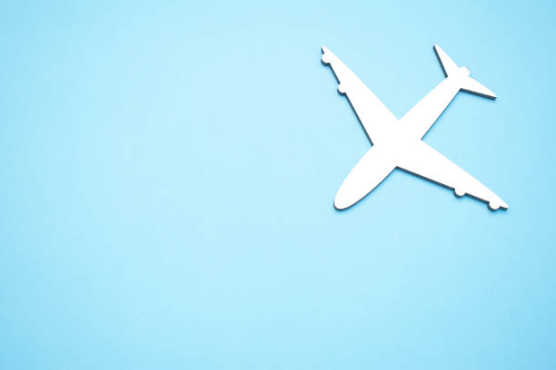 istock Picture of airplane isolated on empty blue background 1339196061