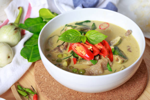 istock Green curry, Thai green curry with beef chilli and eggplant garnished with sliced fresh chilli and basil leaf 1339198750