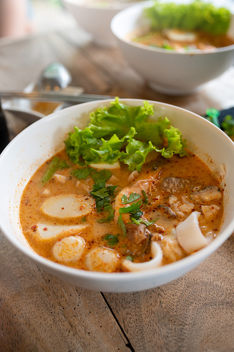 Image of Seafood Tom Yam Spicy Noodle with big shrimp.