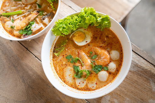 Image of Seafood Tom Yam Spicy Noodle with big shrimp.