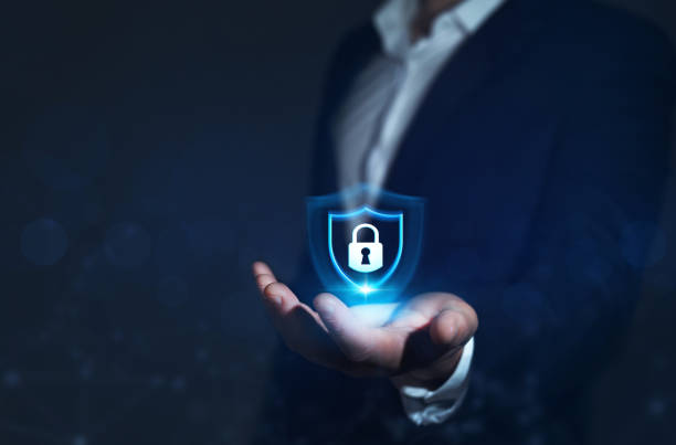 istock Businessman holding padlock in hand. Network security and data protection. Global networking connection background 1339204372