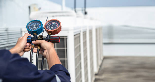 Technician is checking air conditioner ,measuring equipment for filling air conditioners . Technician is checking air conditioner ,measuring equipment for filling air conditioners , service and maintenance air conditioner . cooling tower photos stock pictures, royalty-free photos & images