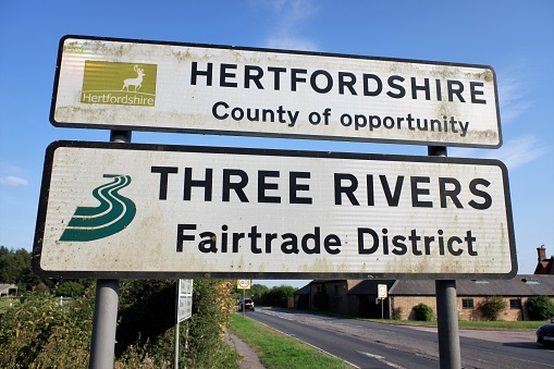 Chorleywood, Hertfordshire, England, UK - September 8th 2021: Hertfordshire County of opportunity and Three Rivers Fairtrade District signs