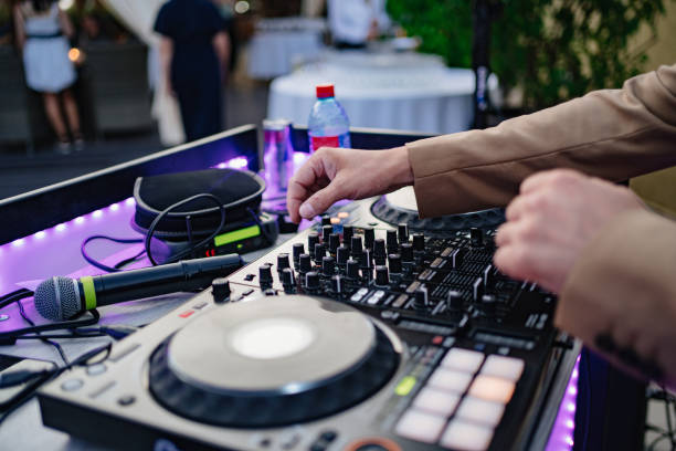 istock DJ's hands on music equipment. Mixers, turntables, switching, acoustics. 1339208307