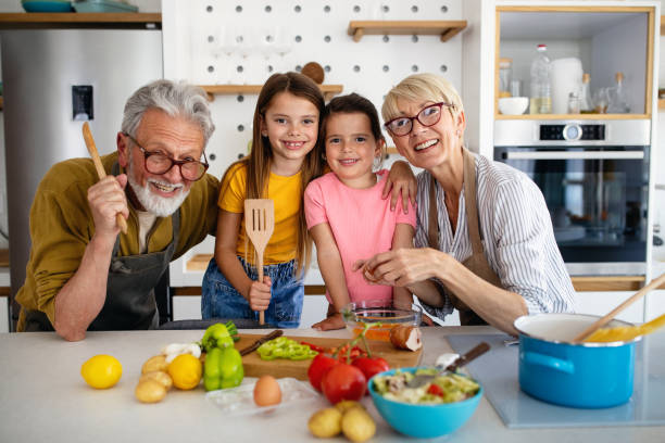 istock Cheerful family spending good time together while cooking in kitchen 1339208733