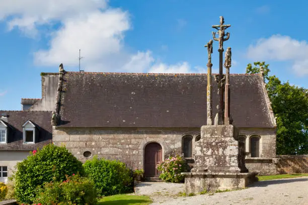 The calvary cross and the ossuary at the Brasparts parish close in Finistère, France.