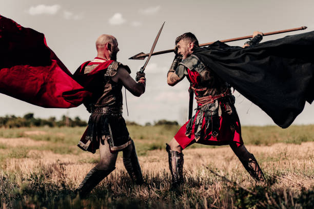 istock Battle between two ancient warriors in battle dress and cloaks. 1339211411