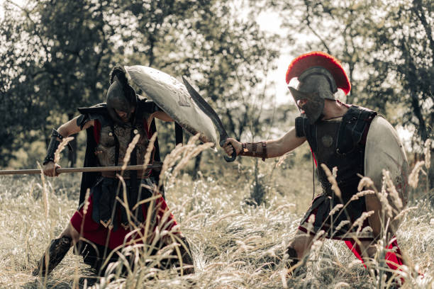 istock Battle with spear and sword between two ancient warriors on meadow. 1339211457