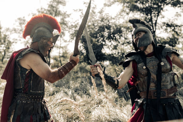 istock Battle with swords between two ancient warriors on meadow. 1339211483