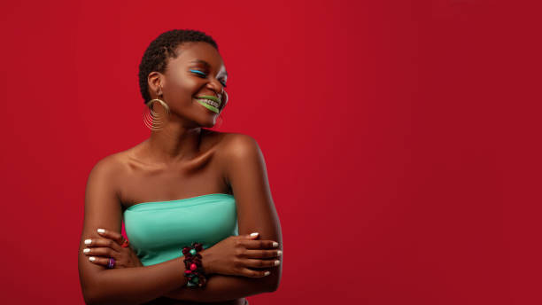 istock Carefree glamorous black lady on red, panorama with copy space 1339212168