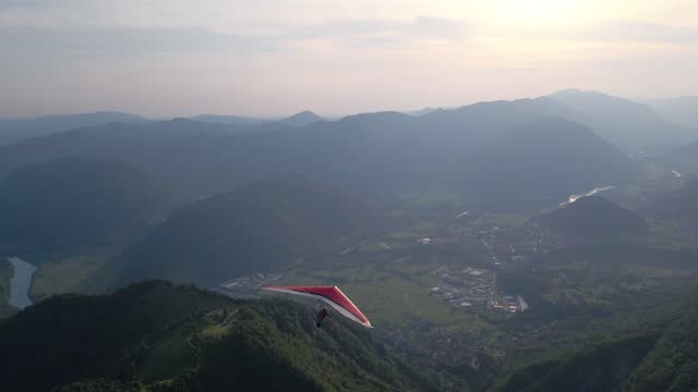 Scenic hang glider take off at the sunset high in the mountains