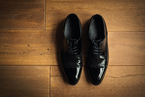 Classic men shoes on a wooden ground