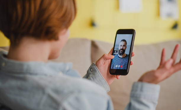 istock Young woman at home making video call using smartphone, social networks concept. 1339212871